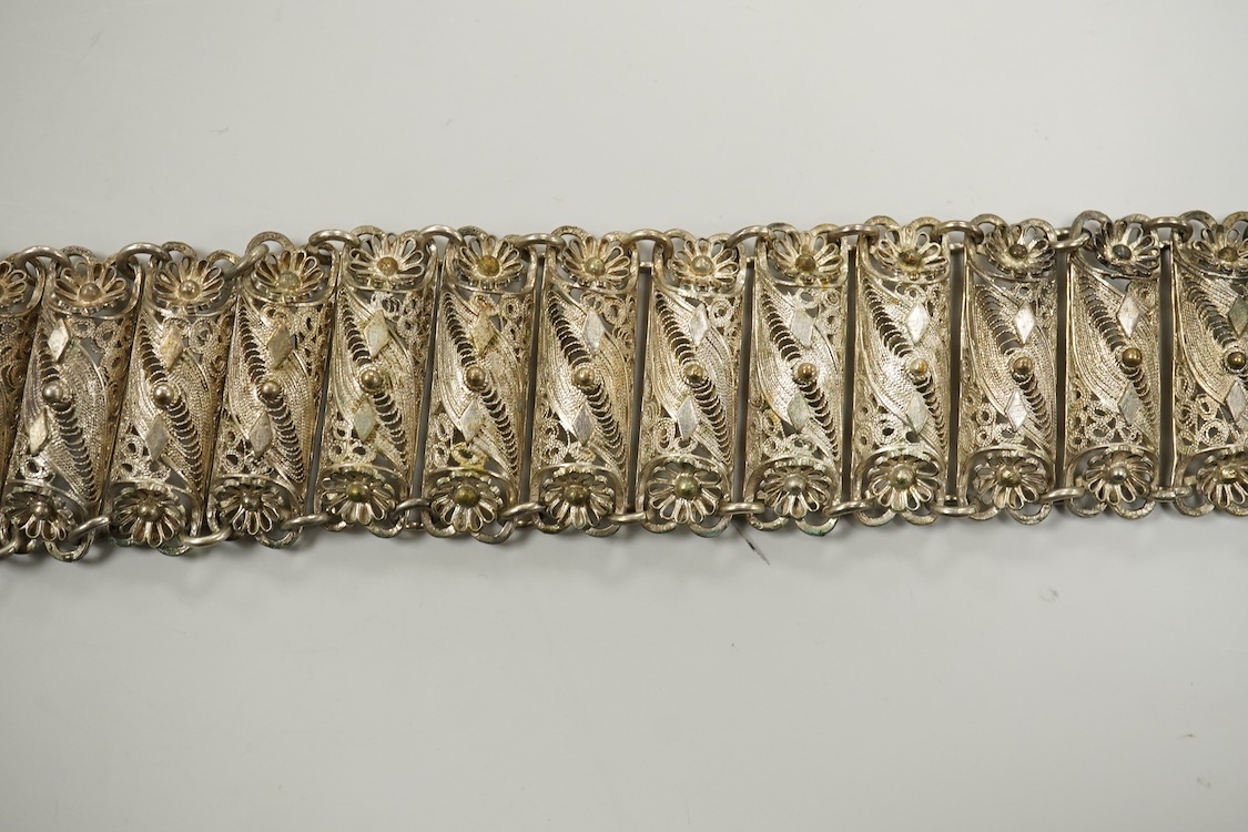 An Indian white metal filigree belt, 86cm.